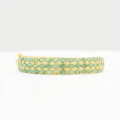 เนตรไอริน กำไลเงิน925 ชุบทอง18K แบบครึ่งวง ประดับมรกต และโทแพซสีขาว