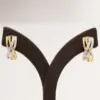 ยูนิช ต่างหูเงิน925 ชุบทอง14K ประดับเพชรสีขาว ดีไซน์ Infinity Hoop